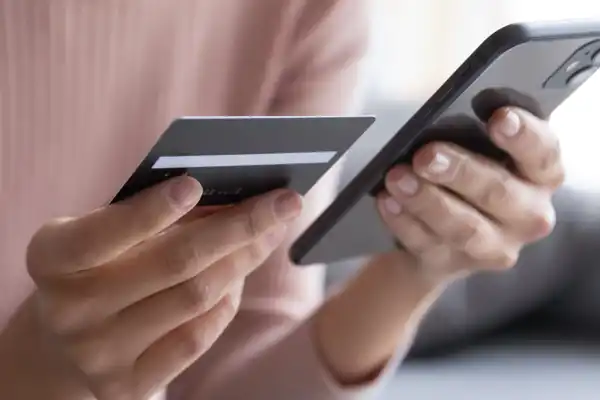 Woman With Credit Card And Phone 1200X1200